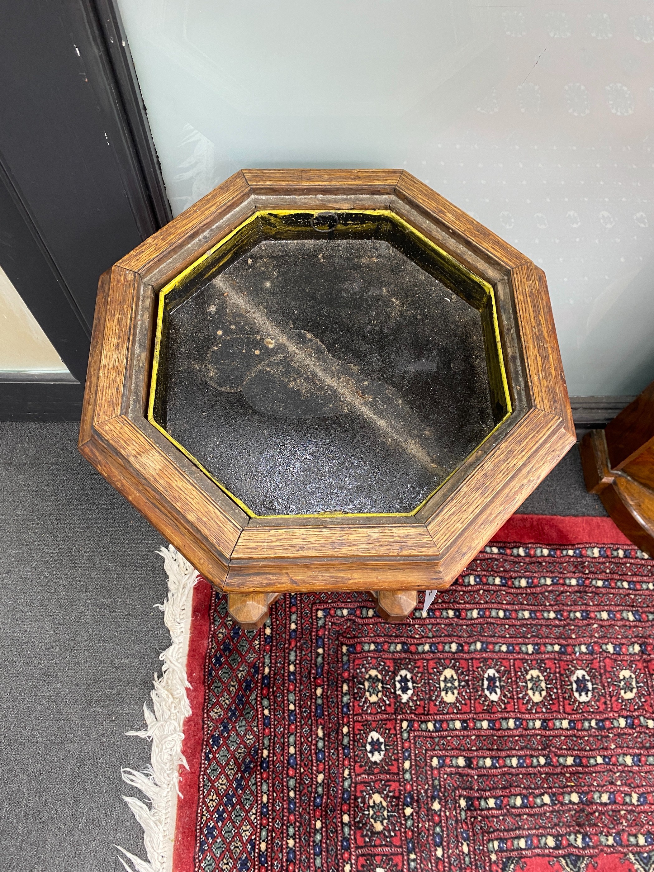 A Victorian Gothic style octagonal oak jardiniere table, width 45cm, height 72cm